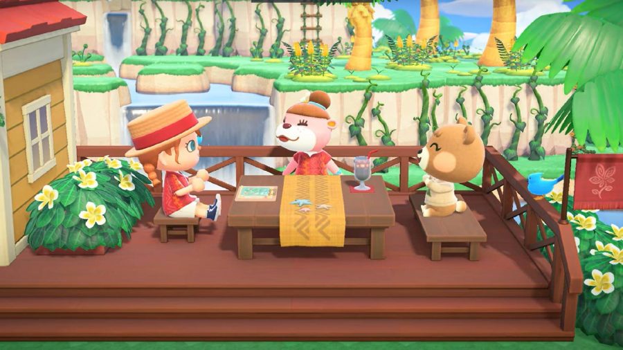 村人が2人の動物のキャラクターと一緒にテーブルに座って、太陽を楽しんでいます