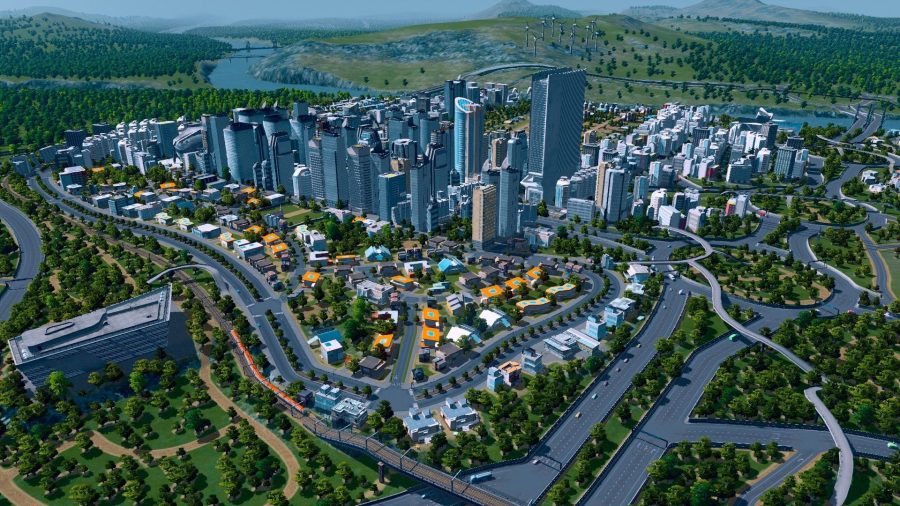 Cities：Skylinesの高層ビルでいっぱいの都市を示すCivilizationのようなゲームのスクリーンショット。