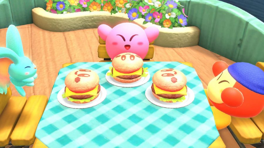 カービィと彼の2人の友人がハンバーガーを食べています