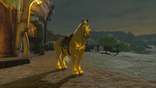 ゼルダの王国の涙の馬小屋の外に立つ金の馬