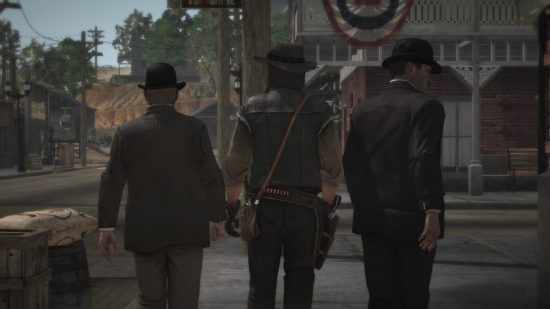 Dead Redemption Switch のレビューを読んでください。町に歩いていく 3 人の男性の後ろ姿を示すスクリーンショットです。 横の二人はスーツとスマートな帽子をかぶっており、真ん中はカウボーイの男です。