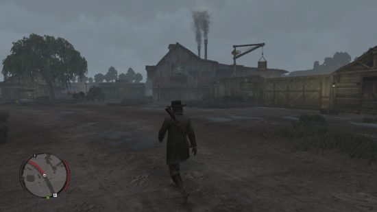 Dead Redemption Switch のレビューを読むスクリーンショットには、屋上から 2 つの煙突が立ち、後ろに小さなクレーンがあるガタガタの建物の前で未舗装のトラックに沿って歩いているカウボーイが示されています。