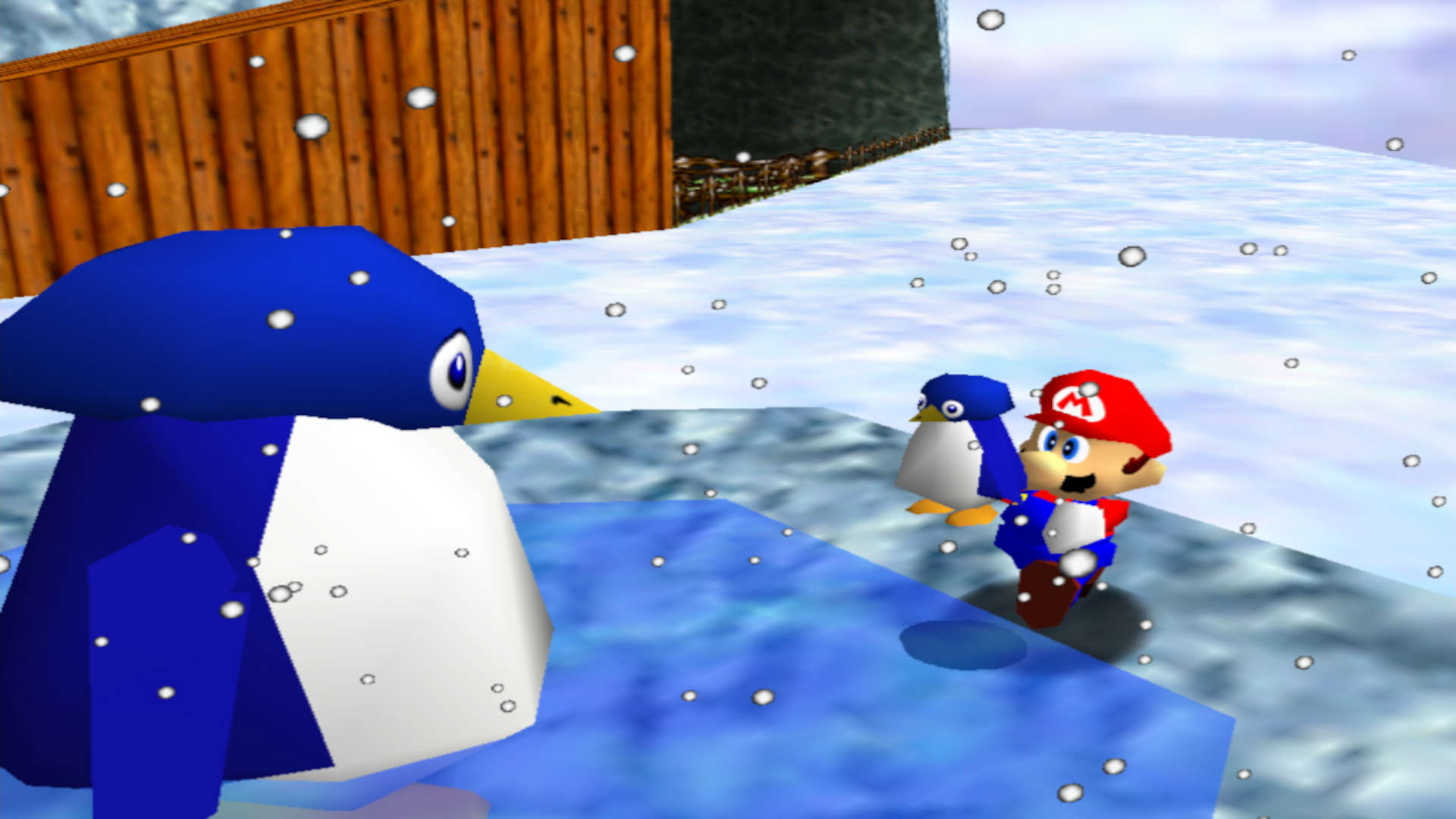 クリスマス ゲーム - 小さなペンギンを自分の 2 倍の大きさのペンギンに向かって持ち上げるマリオ