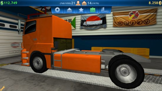 メカニック ゲーム: ガレージにあるオレンジ色のトラックのスクリーンショット